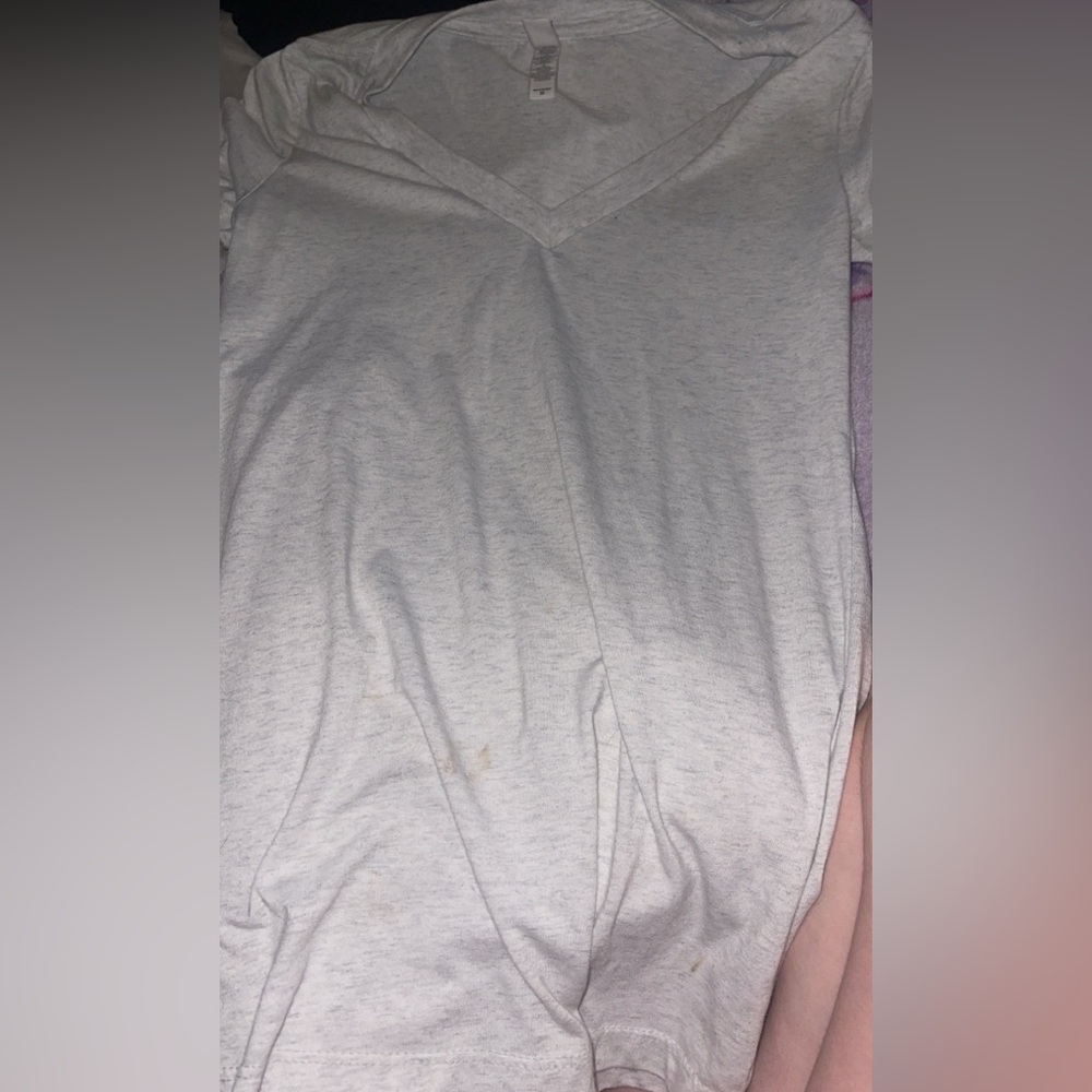Plain light grey t shirt it’s a v neck style size M
